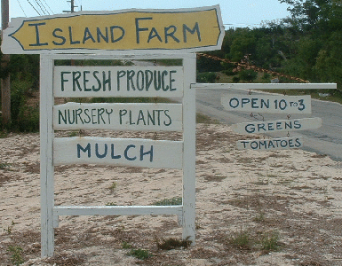 Road side sign in front of island farm